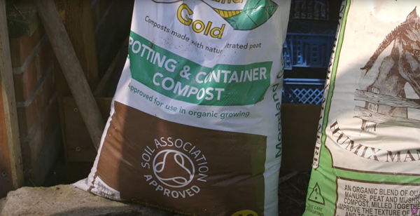 A bag of compost labeled Moorland Gold
