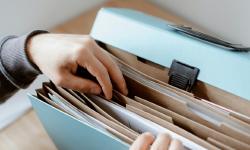 Person choosing document in folder