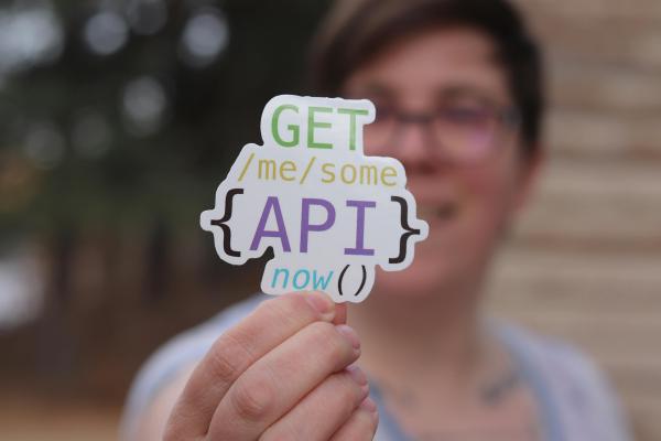 A sticker saying, “Get me you some API, now.”