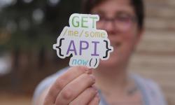 A sticker saying, “Get me you some API, now.”