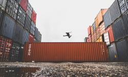 A man jumping on a container