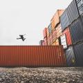 A man jumping on a container