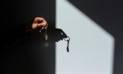 Someone handing over a key