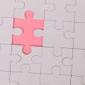 A single puzzle piece separated from the rest of the picture