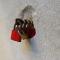 A series of red padlocks attached to a stone wall